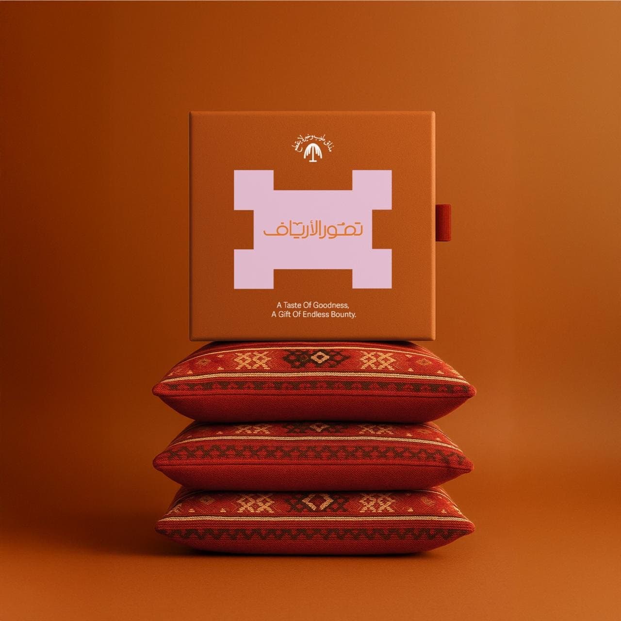 The box staged on a sadu cushion and on ceramic