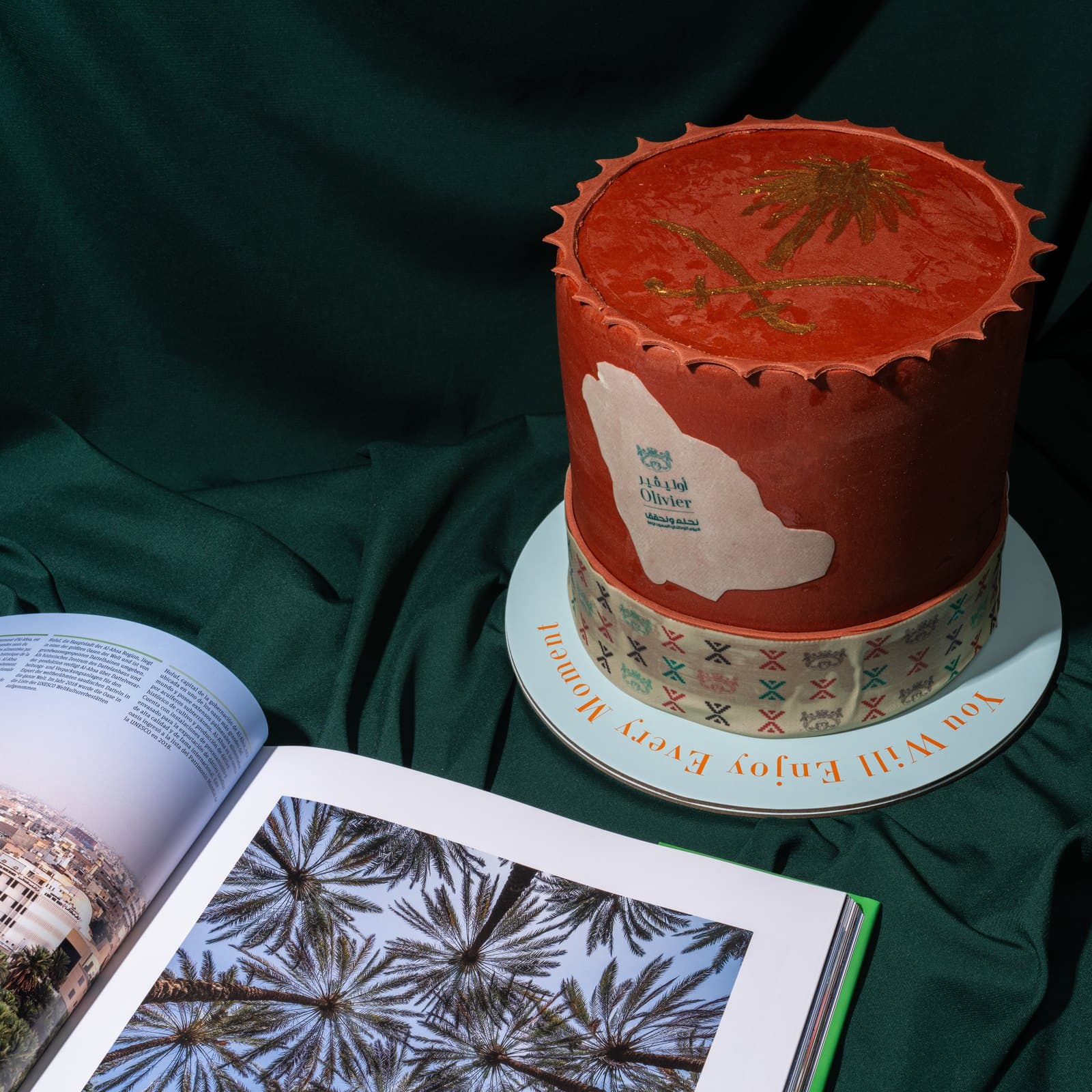 A signature Olivier cake on emerald velvet